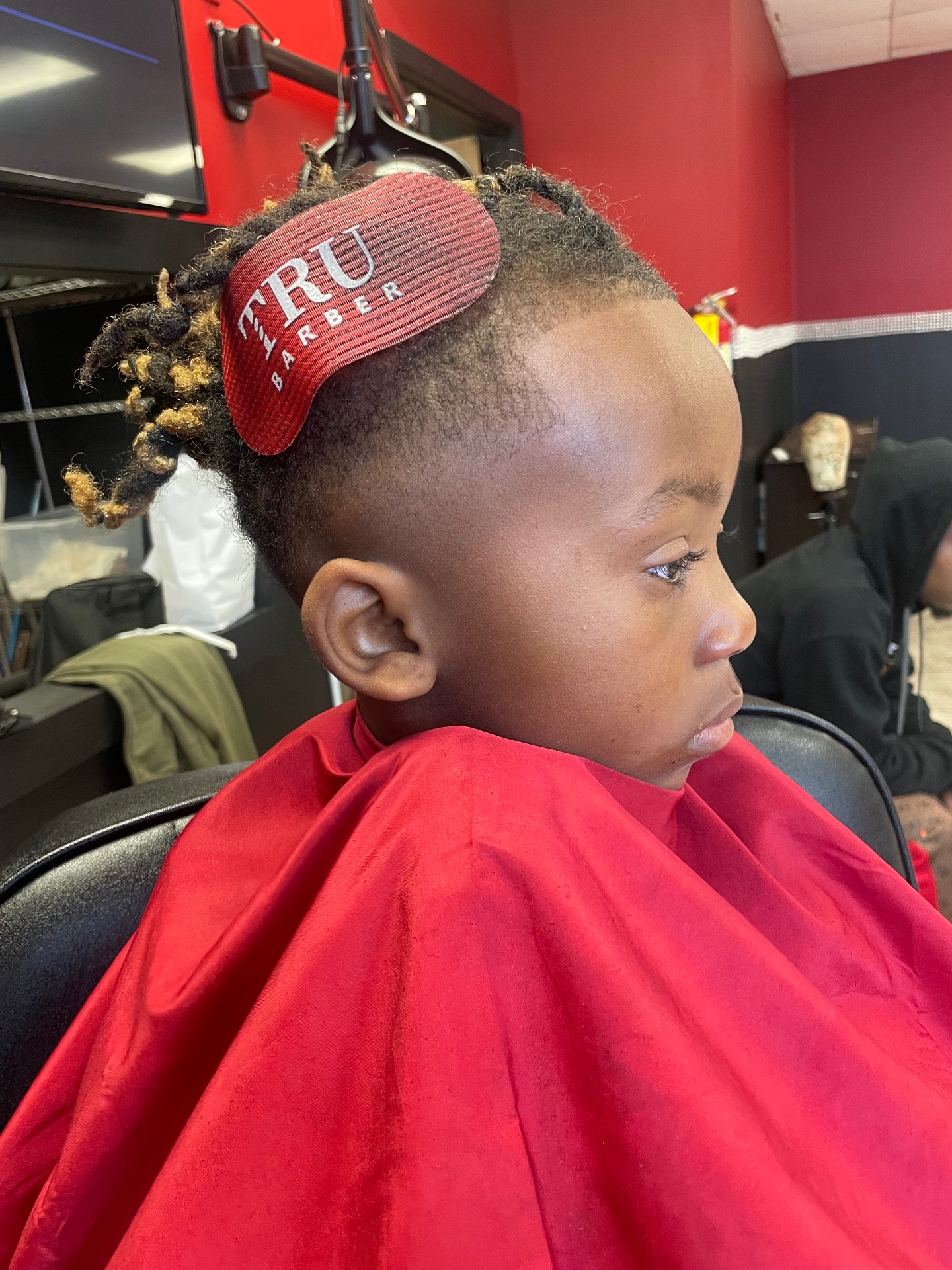 Detailed kids fade with styled locs